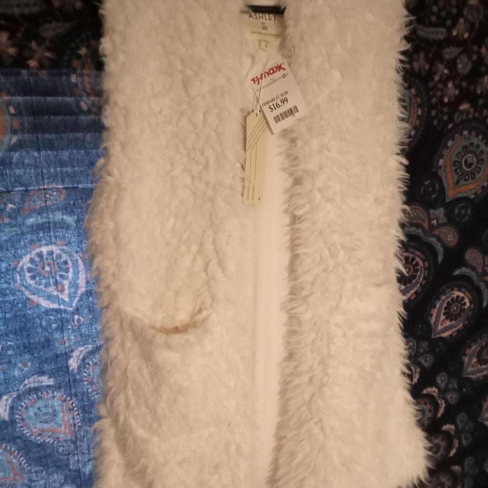 White fur vest